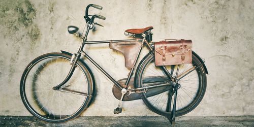 Bicycle leaning on wall