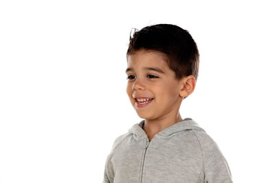 Portrait of smiling boy against white background