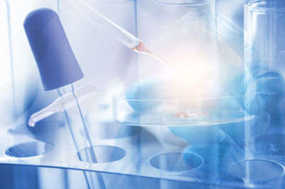 Digital composite image of scientist in laboratory