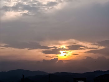 Low angle view of silhouette mountain against sky during sunset