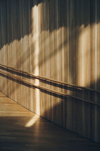 Sunlight on wooden wall in alley of oslo opera house