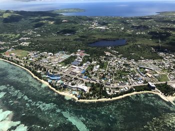 High angle view of buildings by sea