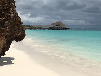 Scenic view of sea against cloudy sky