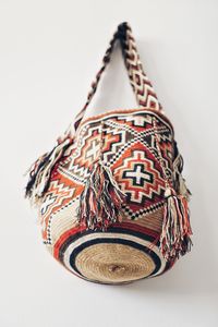 Close-up of multi colored hat on table against white background