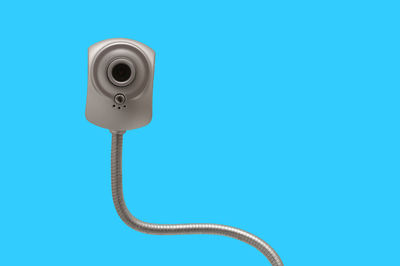 Close-up of webcam over blue background