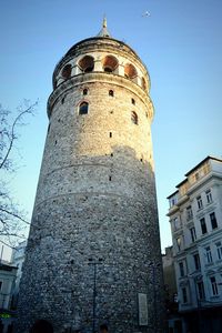 Low angle view of tower against blue sky