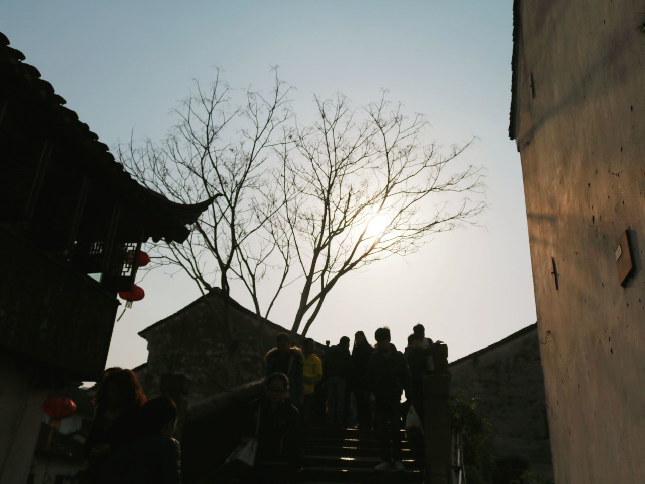 LOW ANGLE VIEW OF SILHOUETTE PEOPLE AGAINST SKY