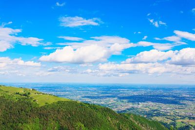 Scenic view of landscape against blue sky