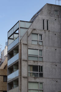 Low angle view of building against clear blue sky