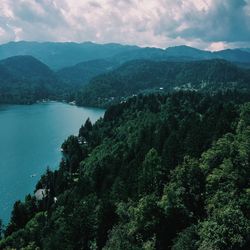 Scenic view of mountains against cloudy sky