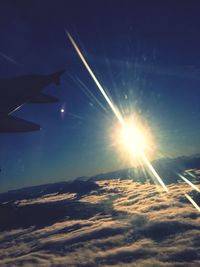 Low angle view of vapor trails against blue sky