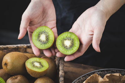 High angle view of hand holding fruits