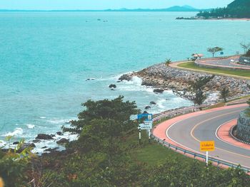High angle view of road by sea against sky