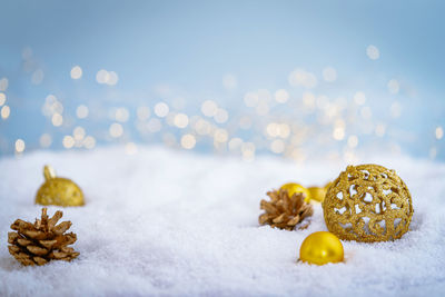 Close-up of christmas decorations on snow