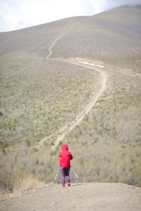Rear view of man walking land