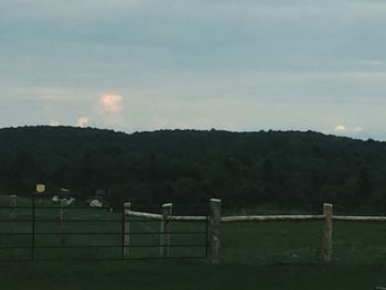 Scenic view of mountains against cloudy sky