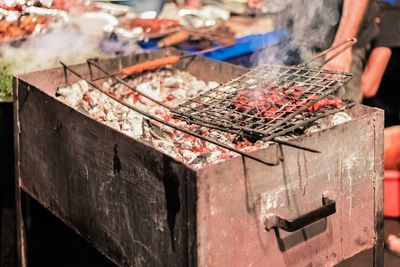 Close-up of heating coal in bbq