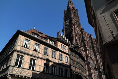 Low angle view of building against blue sky