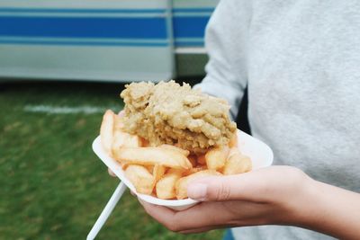 Close-up of hand holding food