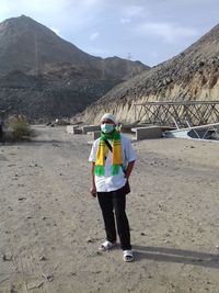 Full length of man walking on road