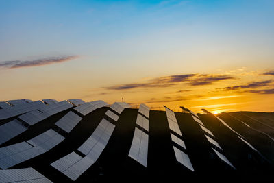 Low angle view of building against sky during sunset