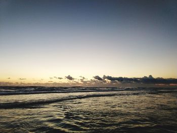 Scenic view of sea against clear sky during sunset