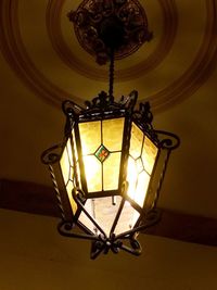 Low angle view of chandelier hanging from ceiling