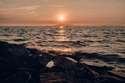 Scenic view of sea against sky during sunset