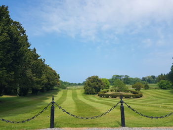 Scenic view of green landscape against sky