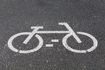 High angle view of bicycle lane sign on road