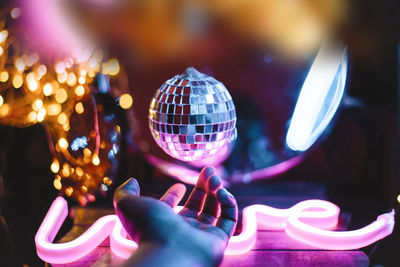 Close-up of illuminated lighting equipment at night