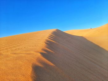 Hill of sand dunes on desert