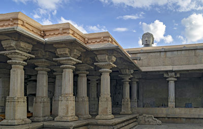 Stone carved temple and statue of lord bahubali in shravanbela gola, karnataka.