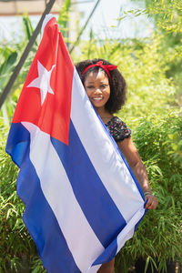 Young woman holding american flag