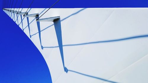 Low angle view of staircase against blue sky