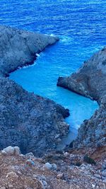 High angle view of rocks at sea shore