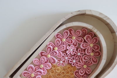 High angle view of pink roses on white table