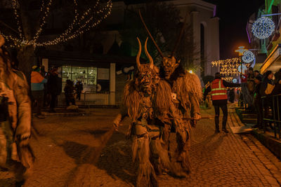 People on street in city at night