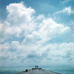 Scenic view of sea against cloudy sky