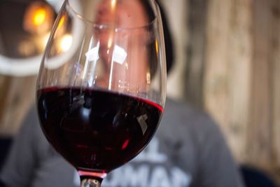 Close-up of hand holding wineglass