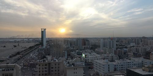 High angle view of buildings against sky during sunset