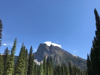 Scenic view of mountains against clear blue sky