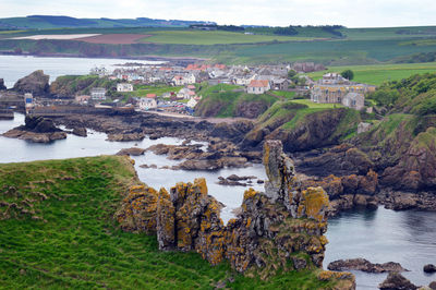 Scenic view of sea and rocks against sky