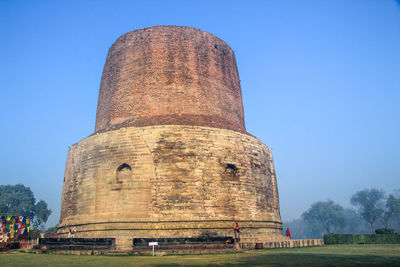 Low angle view of historical building against blue sky