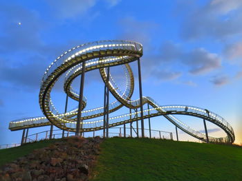 Low angle view of illuminated tiger and turtle against sky