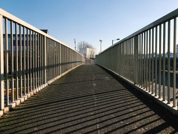 Footbridge against clear sky