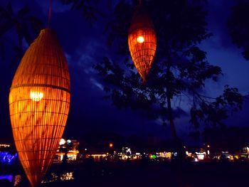 Low angle view of illuminated lanterns at night