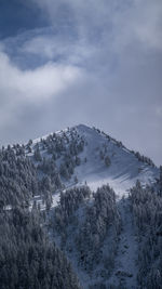 Scenic view of snow covered mountains against sky