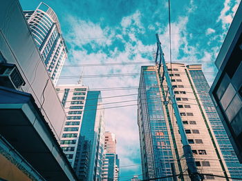 Low angle view of modern buildings against sky