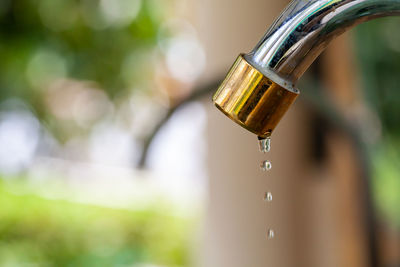 Close-up of water falling from faucet